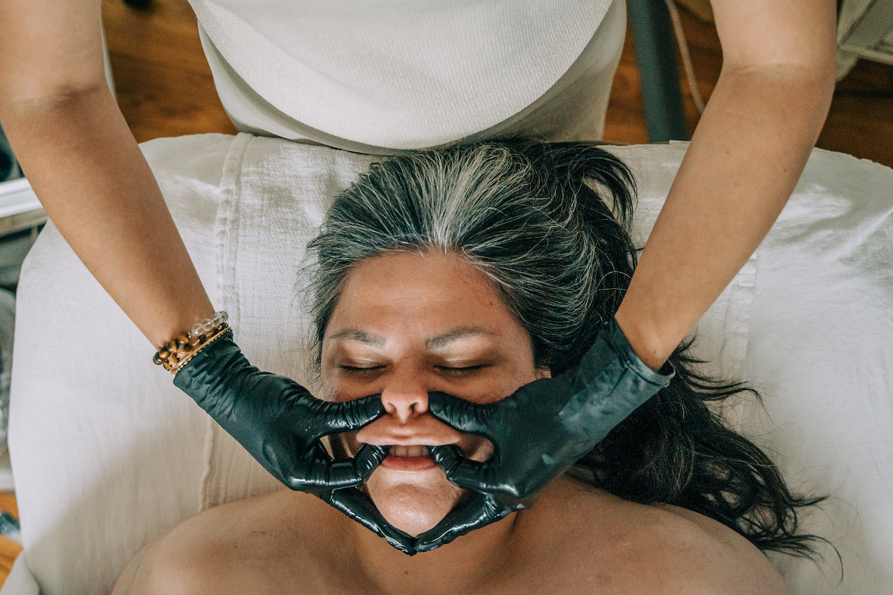 Marissa Duarte performing buccal facial massage at Beauty Republic Tucson AZ